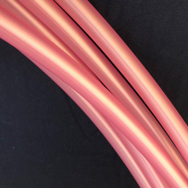 Shakti - Orangey pink metallic finish hula hoop tubing with gold iridescence