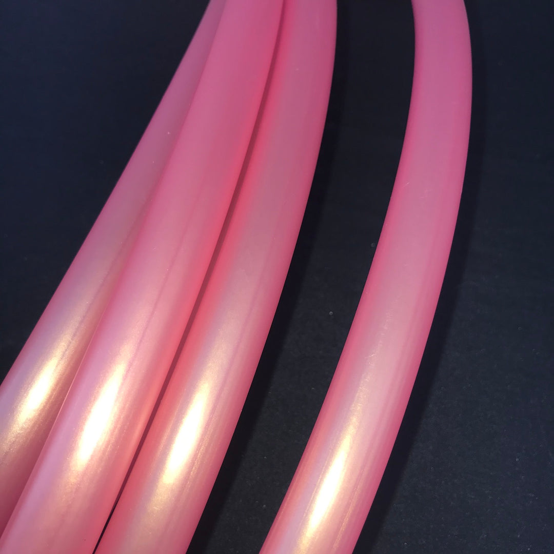 Shakti - Orangey pink metallic finish hula hoop Looks very different under different lights