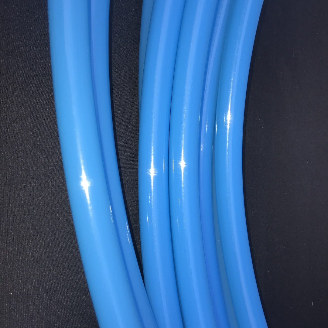 bioluminescent blue uv polypro gloss tubing.Aduly shiny hula hoops in bright blue.