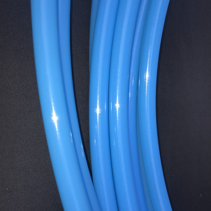 bioluminescent blue uv polypro gloss tubing.Aduly shiny hula hoops in bright blue.