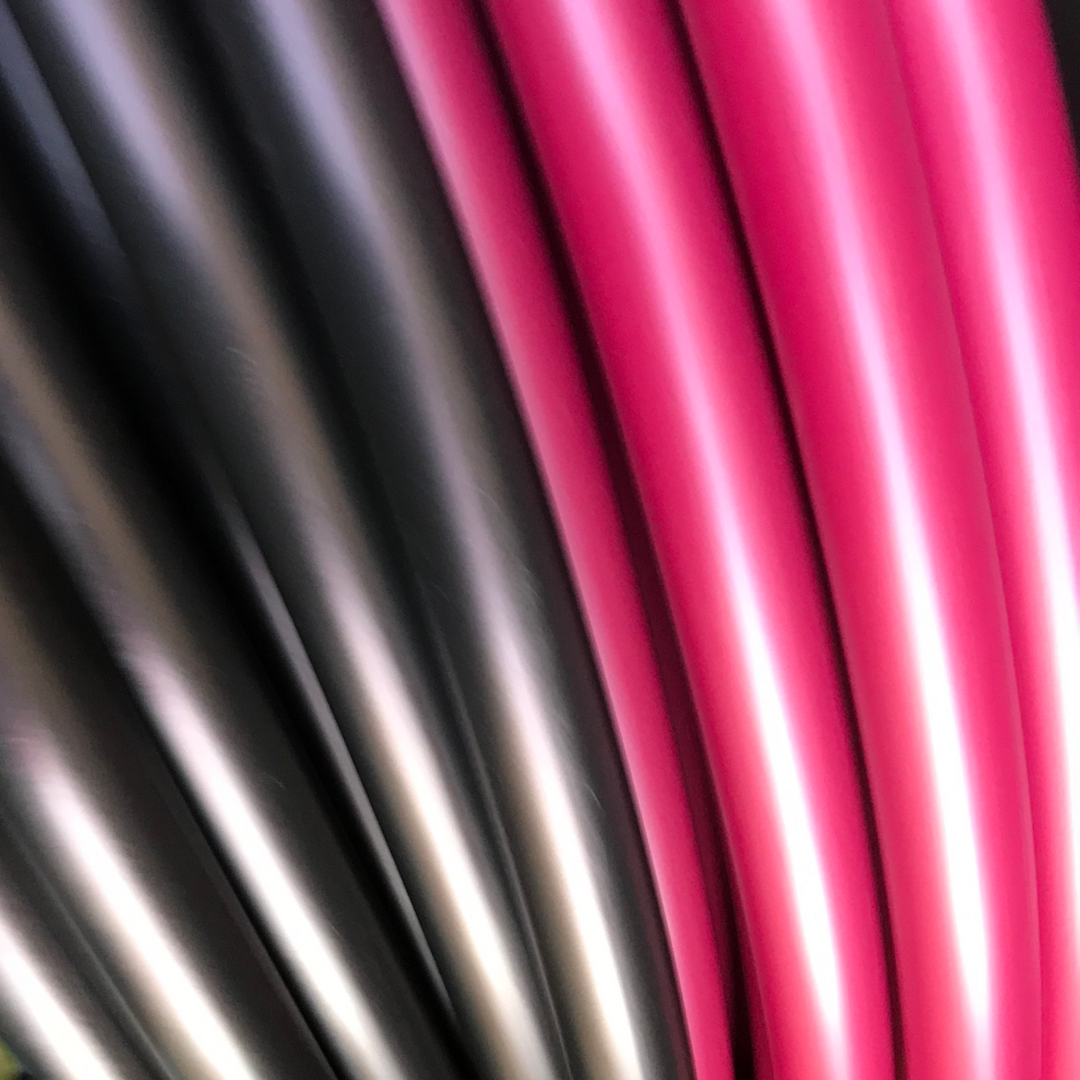 Black cherry and Black widow metallic hula hoops. Black tubing with red iridescence. Stunning hula hoops 
